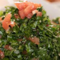 Tabouleh Salad · Parsley, mint, onion, tomato, burgul, olive oil and lemon.