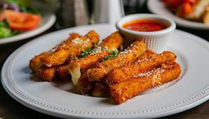 Mozzarella Fritti · Fresh cut mozzarella lightly battered and fried to a golden brown. Served with Russo's homem...