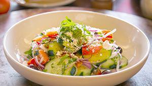 Cucumber and Feta Salad · Sliced cucumber with feta cheese, Roma tomatoes, red onions, Kalamata olives, and garlic, to...