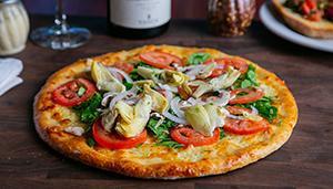 Heart Healthy Veggie Pizza · Fresh spinach, artichokes, white onions, mushrooms, Roma tomatoes, basil and Wisconsin mozza...