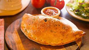 Create Your Own Calzone · Mozzarella with up to 3 toppings. Served with Russo's homemade marinara sauce.