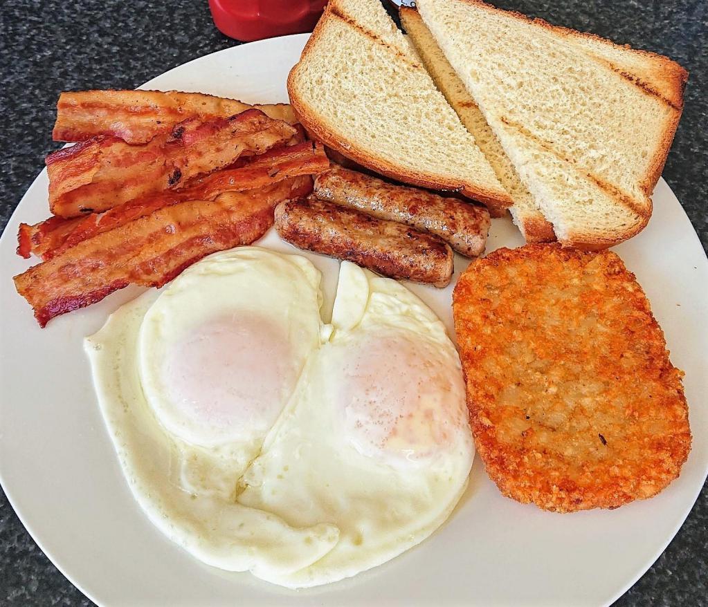 American Breakfast · Your choice of toast, bacon, sausage, 2 eggs any style, Hash Brown