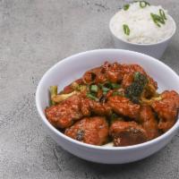 Orange Chicken · Dark meat chicken chunks sauteed with orange peels and red chili peppers along with steamed ...