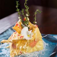 Crabmeat Ravioli · Battered fried crabstick, cream cheese with OP mayo and tobiko.