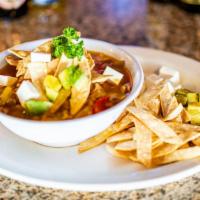 Chicken Tortilla Soup · Served with tortilla strips, avocado and cheese.