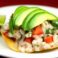 Ceviche de Pescado · A blend of fresh sea bass fish, onions, cilantro, tomatoes and cucumber. Cooked in fresh lim...