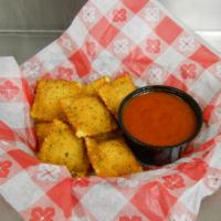 Toasted Ravioli · Eight crispy breaded raviolis, stuffed with our four-cheese blend. Served with marinara sauce.