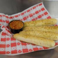 Soft Bread Sticks · Four soft bread sticks seasoned with our special garlic seasoning, topped with Romano cheese...