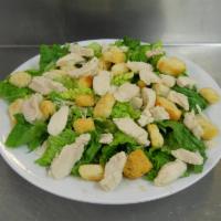 Caesar Salad with Chicken  · Crispy romaine lettuce and shaved Parmesan cheese and herbed croutons.