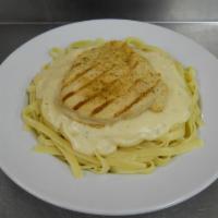 Chicken Alfredo Pasta · Grilled boneless breast of chicken covered with a rich creamy, cheese sauce served over spag...