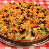 Taco Specialty Pizza · Seasoned ground beef, topped with cheddar cheese, black olive, tomatoes, lettuce and mild or...