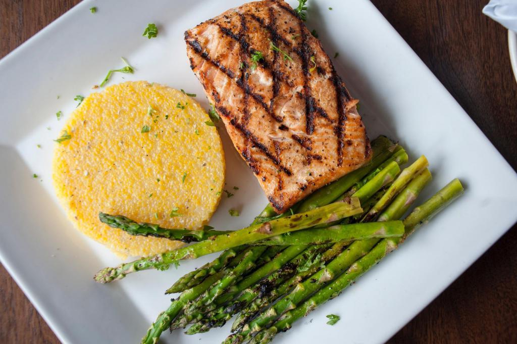 Salmon · 8 oz. of grilled wild Alaskan salmon filet served with grilled asparagus and fries.