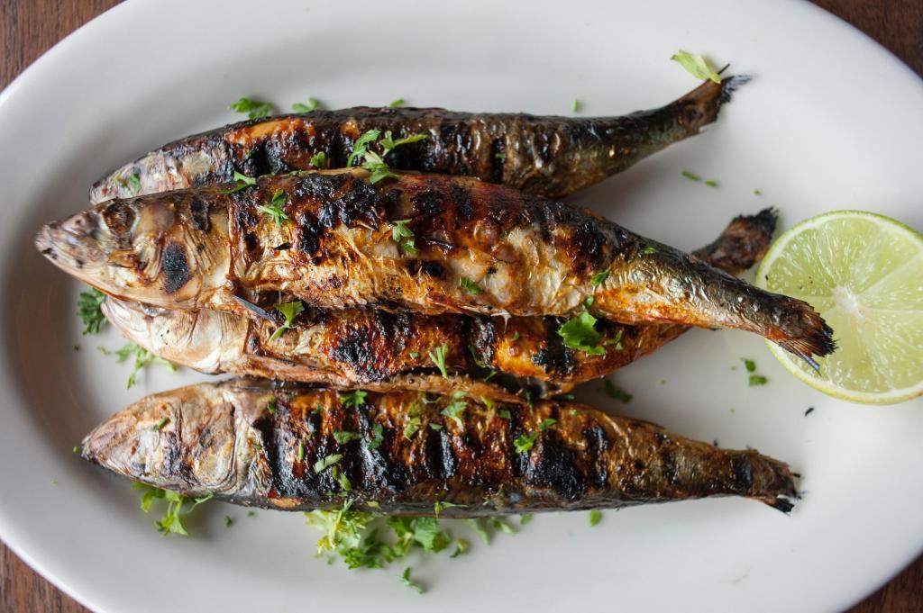 Grilled Sardines with French Fries · 