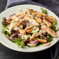 Greek Chicken Salad · Marinated grilled chicken breast on a bed of mixed greens topped with tomatoes, cucumbers, r...