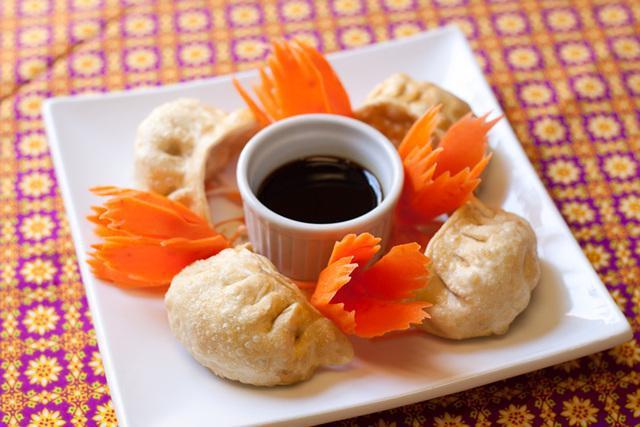 Thai Dumpling · 6 pieces. Shrimp and pork mixed together then wrapped in pot sticker skin. Served with house special sauce.