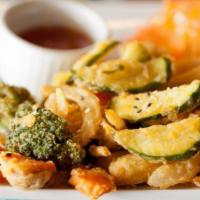 Tempura Veggies · Fried vegetables mixed in tapioca flour served with sweet chili sauce.