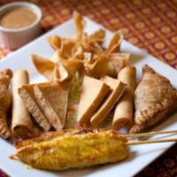Siam Orchid Combo Appetizers · Consists of 2 chicken satay, 2 spring rolls, 2 curry puff, 3 crab cheese wonton, 4 crispy to...