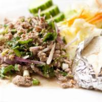 Larb Salad · Chopped chicken, pork, fried tofu or steamed salmon with shallot, green onions, cilantro, ka...