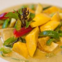 Pumpkin Curry · Medium red curry in coconut milk with meat, bell peppers, zucchini, pumpkin and Thai basil.
