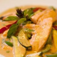 Salmon Curry · Medium green curry in coconut milk with salmon, bell peppers, zucchini, eggplants and Thai b...