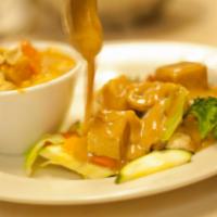 Pra Ram · Mixed steamed veggies and stir-fried meat. Topped with peanut sauce and ground peanuts. Incl...