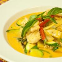 Panang Curry · Medium panang curry in coconut milk with bell peppers, zucchini, green peas, kaffir lime lea...