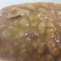 BBQ Beans · Slow simmered white beans blended with with our smoked beef brisket, tri-tip and sauteed oni...