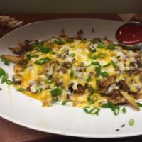 Alamo Loaded Fries · Hand cut fries, melted cheddar and homemade Angus beef chili.