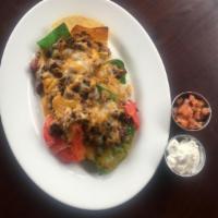 Slide BBQ Nachos · Tortilla chips, homemade chili, melted five blend cheese, sour cream, salsa, jalapeno and sl...