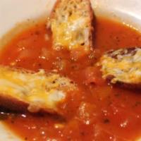 Tomato Soup · Rustic tomato soup with cheese crostini.