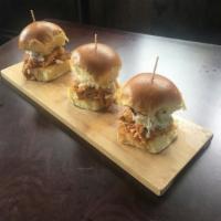 Spicy Smoked Pulled Chicken Slider · Hand shredded smoked chicken breast, house-made coleslaw, tossed in Buffalo sauce.