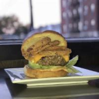 The American Burger · Angus beef topped with American cheese, fried onion ring, lettuce, tomato and chipotle aioli...