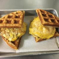 Slide Impossible Breakfast Sandwich · Homemade cheddar waffle, 2 plant based breakfast sausage patties , 2 eggs, American cheese