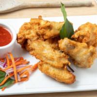 6. Crispy Garlic Wings · 6 pieces chicken wings marinated in garlic spice and fried to golden brown, served with swee...