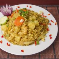 30. Pineapple Fried Rice · Stir-fried rice with eggs, carrot, green onion, pineapple, tomato, curry powder and roasted ...