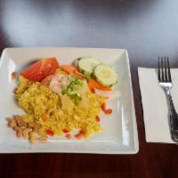 31. Curry Fried Rice · Stir-fried rice with eggs, curry powder, carrot, roasted cashew, bell pepper and pineapple.