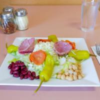 Antipasto Salad · Iceberg lettuce, romaine lettuce, salami, pepperoni, kidney beans, garbanzo beans, olives, t...