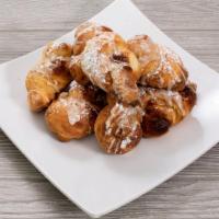 8 Piece Cinnamon Sugar Knots · Baked with cinnamon sugar and topped with vanilla icing and powdered sugar.