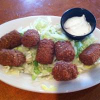 Falafel · Crushed garbanzo beans, parsley and spices, rolled together, fried and served with tzatziki ...
