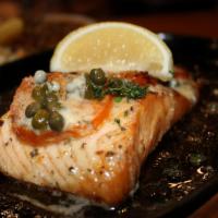 Salmon · Salmon filet, brushed with our herbed, lemon-butter sauce and topped with Spanish capers. Se...