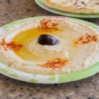 Hummus · Blended chickpeas, tahini, olive oil, garlic and lemon juice.