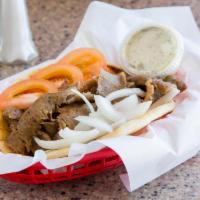 1. Gyros Pita · Thinly sliced layers of seasoned beef & lamb broiled on a vertical skewer with onions, tomat...