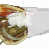 9. Picado Pita · Thinly sliced gyro meat grilled with onions and jalapenos topped with tomato and our very ow...