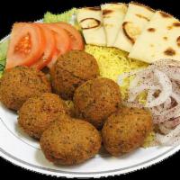 23. Falafel Plate · Deep-fried patties of ground chickpeas mixed with herbs and spices with onion, tomato, lettu...