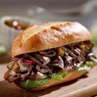 29. Philly Steak Sandwich · Thinly sliced steak served with grilled onion, bell peppers and topped with melted mozzarell...