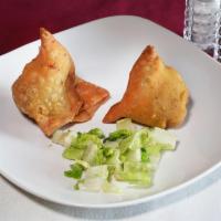 1. Vegetable Samosa · 2 Indian pastries stuffed with delicately spiced mashed potatoes and deep fried. Vegan.