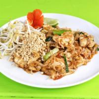Pad Thai · Rice noodles stir fried with choice of meat, egg, green onions and bean sprouts and tamarind...