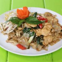 Pad Kee Mao · Wide rice noodles stir-fried with choice of meat, egg, onions, bell peppers, fresh chili, ga...