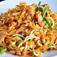 Pad Tom Yum · Stir fried rice noodles with choice of meat, egg, green onions, basil and bean sprouts in to...