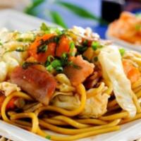 Kee Mao Yakisoba · Egg noodles stir fried with egg, onions, bell peppers, basil, chili and garlic top with bean...
